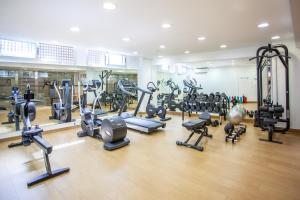 a gym with several treadmills and cardio machines at Grupotel Maritimo in Port d'Alcudia