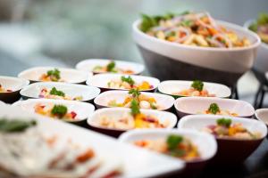 a bunch of plates of food on a table at Grupotel Maritimo in Port d'Alcudia