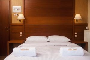 Postelja oz. postelje v sobi nastanitve Hotel Steni