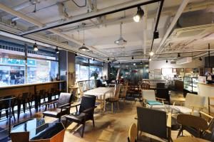 a restaurant with tables and chairs and a bar at STAY7 Myeongdong in Seoul
