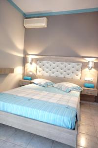 Posteľ alebo postele v izbe v ubytovaní Blue Dream Hotel