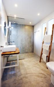 a bathroom with a sink and a mirror at Karma Minoan in Agios Nikolaos