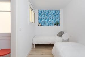 Posteľ alebo postele v izbe v ubytovaní Casa Cosi - Eixample 3