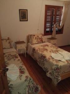Postelja oz. postelje v sobi nastanitve Villa Leonidas