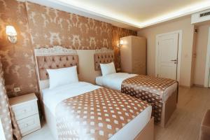 A bed or beds in a room at Istanroom by Keo