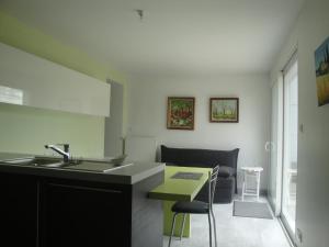 a kitchen with a sink and a counter top at Maison de vacances in Concarneau