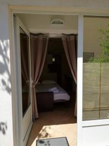 Postel nebo postele na pokoji v ubytování Studio apartman Zana