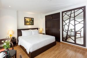 Postel nebo postele na pokoji v ubytování Hotel De La Seine