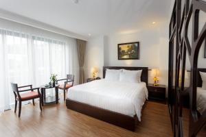 Postel nebo postele na pokoji v ubytování Hotel De La Seine