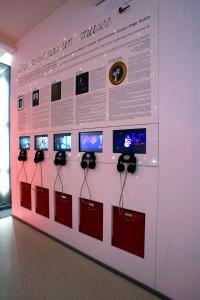 a wall with a bunch of cell phones on it at Hôtel du Triangle d'Or - Proche Madeleine in Paris