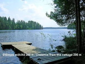 a dock on a lake with the words fidelity mobile m distance from at Holiday Home Suvikumpu by Interhome in Tuusmäki