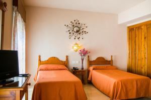 Un pat sau paturi într-o cameră la Hotel La Nava