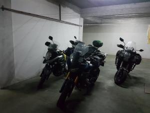 a group of motorcycles parked in a garage at Motel Maksumić in Jablanica