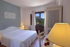 Rúm í herbergi á Boutique Hotel Sant'Andrea & Relais