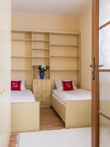 Posteľ alebo postele v izbe v ubytovaní ZAKOHOME- Apartamenty Kościelisko Centrum