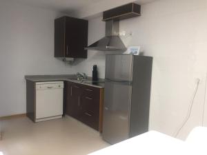 Kuchnia lub aneks kuchenny w obiekcie Portosín -Suites