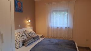 A bed or beds in a room at TimiBá