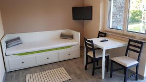 A bed or beds in a room at TimiBá