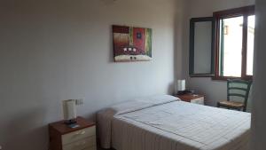 A bed or beds in a room at Casa Sant'Anna