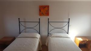 A bed or beds in a room at Casa Sant'Anna