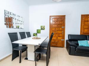 a dining room with a table and chairs at Villa Aurelie by Interhome in Balcon del Mar