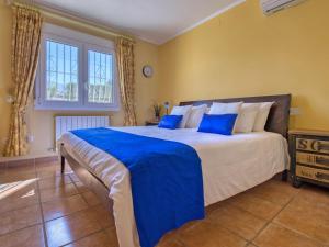 A bed or beds in a room at Villa Villa Meena by Interhome