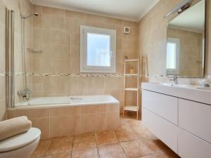 A bathroom at Villa Villa Meena by Interhome