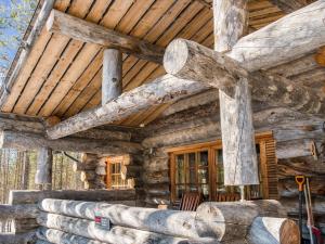 a log cabin with a wooden ceiling at Holiday Home Suutarinkolo by Interhome in Levi