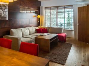 O zonă de relaxare la Holiday Home Tahko spa junior suite orange b2 by Interhome