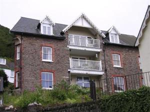 a brick house with a balcony on top of it at Holiday Home Ferndale House by Interhome in Lynmouth