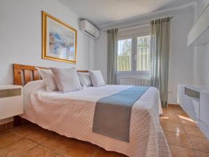 A bed or beds in a room at Villa Villa Meena by Interhome