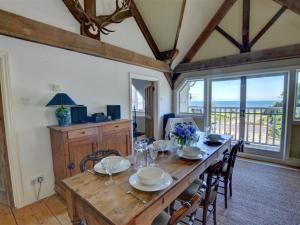 a dining room with a wooden table and chairs at Holiday Home Ferndale House by Interhome in Lynmouth