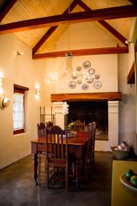 A restaurant or other place to eat at Vineyard Cottage at Bosman Wines
