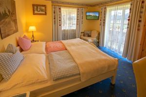 Postel nebo postele na pokoji v ubytování Romantik Aparthotel Sonnleitn