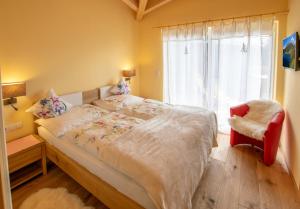 Postel nebo postele na pokoji v ubytování Romantik Aparthotel Sonnleitn