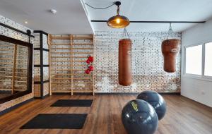 a room with a gym with some punching bags and mats at Gran Hotel Flamingo-Adults Only older 18 years old in Lloret de Mar