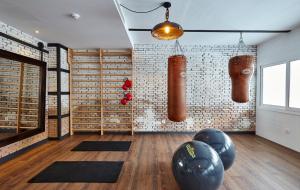 a room with a gym with some punching bags and mats at Gran Hotel Flamingo-Adults Only in Lloret de Mar
