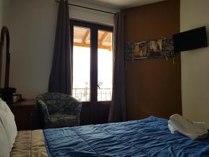 Llit o llits en una habitació de Petra & Elato Art Hotel