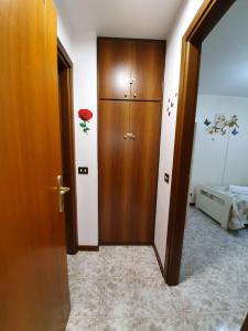 Ένα ή περισσότερα κρεβάτια σε δωμάτιο στο casa vacanza sogni d'oro
