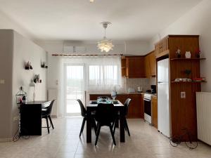 A kitchen or kitchenette at Chania Lissosaparments