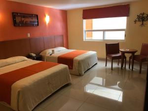 Postel nebo postele na pokoji v ubytování Hostalia Hotel Expo & Business Class + 37 fotografií