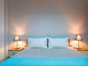 Voodi või voodid majutusasutuse Sunset Boulevard Hotel toas