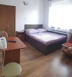Łóżko lub łóżka w pokoju w obiekcie Pokoje Gościnne Pryzmat