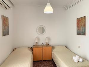 A bed or beds in a room at Chania Lissosaparments