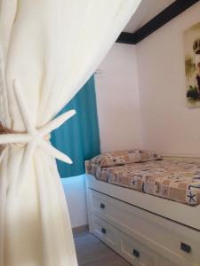 Posteľ alebo postele v izbe v ubytovaní PRECIOSA CASITA JUNTO AL MAR