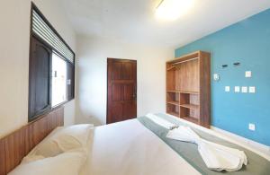 Cama o camas de una habitación en Pousada Cores dos Corais