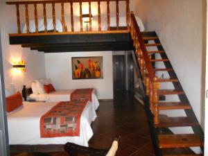 Letto o letti in una camera di Hotel Hacienda Taboada (Aguas Termales)