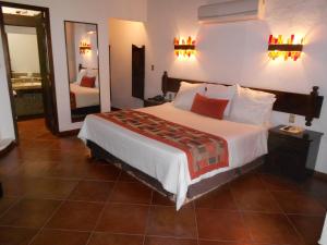 Letto o letti in una camera di Hotel Hacienda Taboada (Aguas Termales)