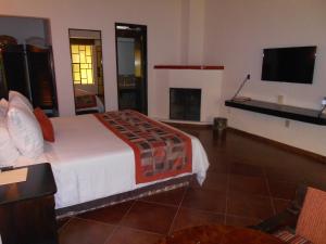 TV o dispositivi per l'intrattenimento presso Hotel Hacienda Taboada (Aguas Termales)