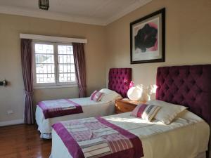 Кровать или кровати в номере Hostal Viña Malva